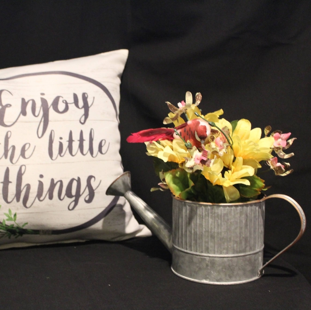 Rustic sprinkler flower arrangement